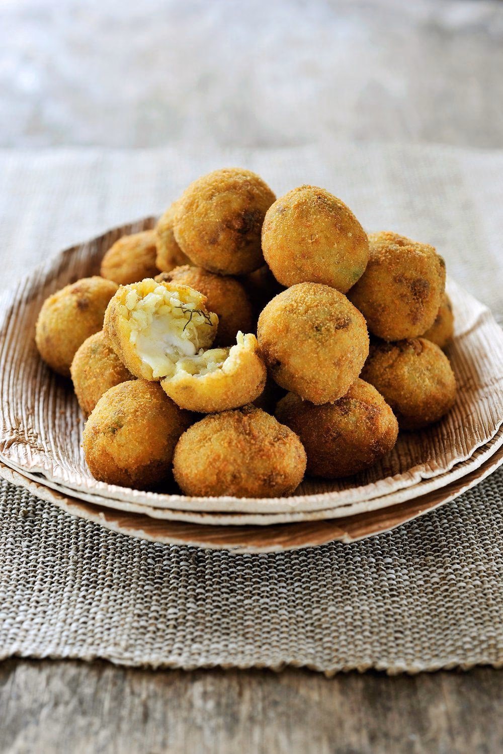 Why do Sicilians eat arancini?