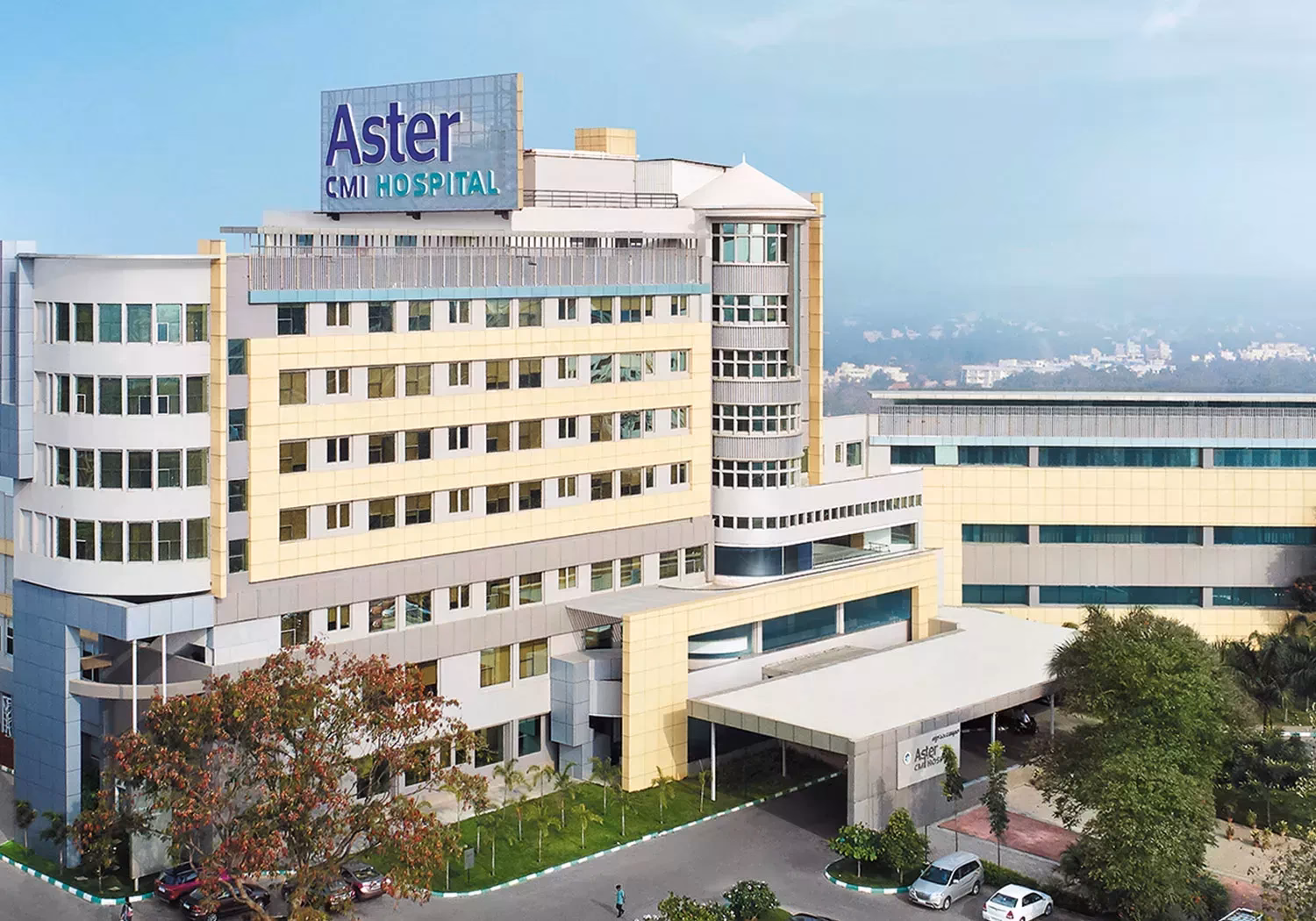 How many beds does Aster CMI have?