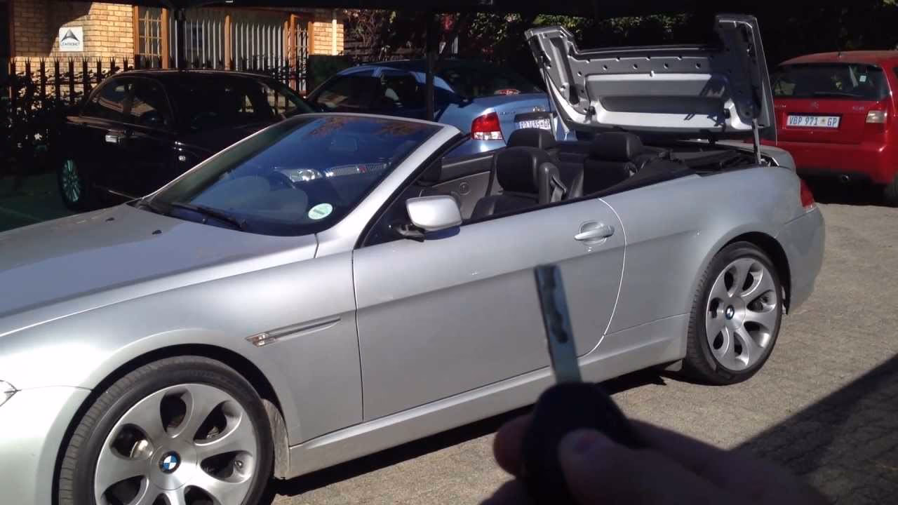 How do I unlock a convertible top compartment?