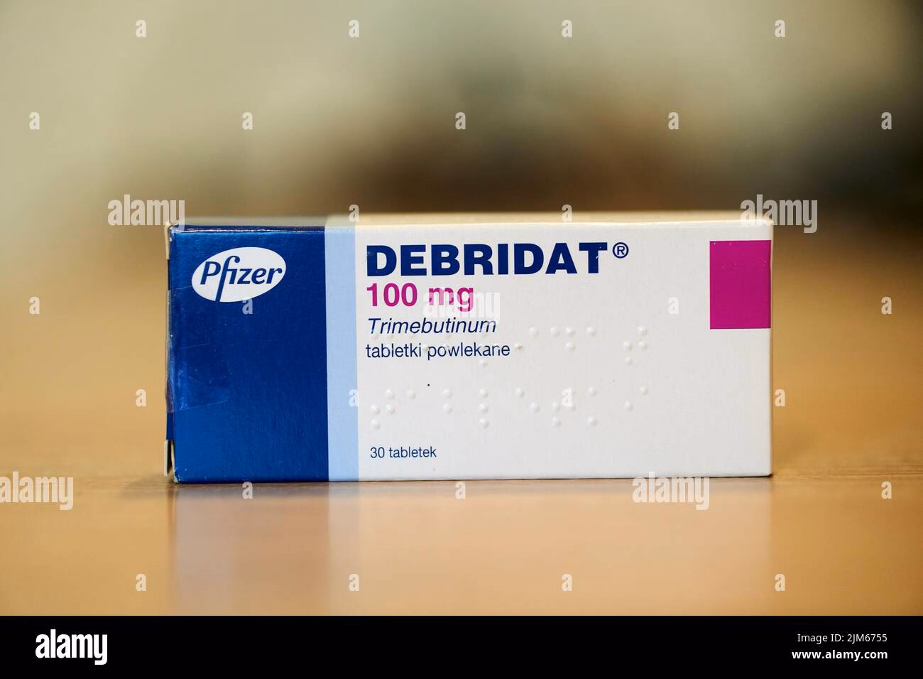 How does Debridat 100mg help regulate bowel movements?