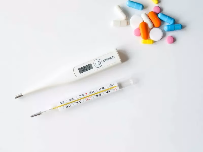 What temperature is considered a low grade fever?