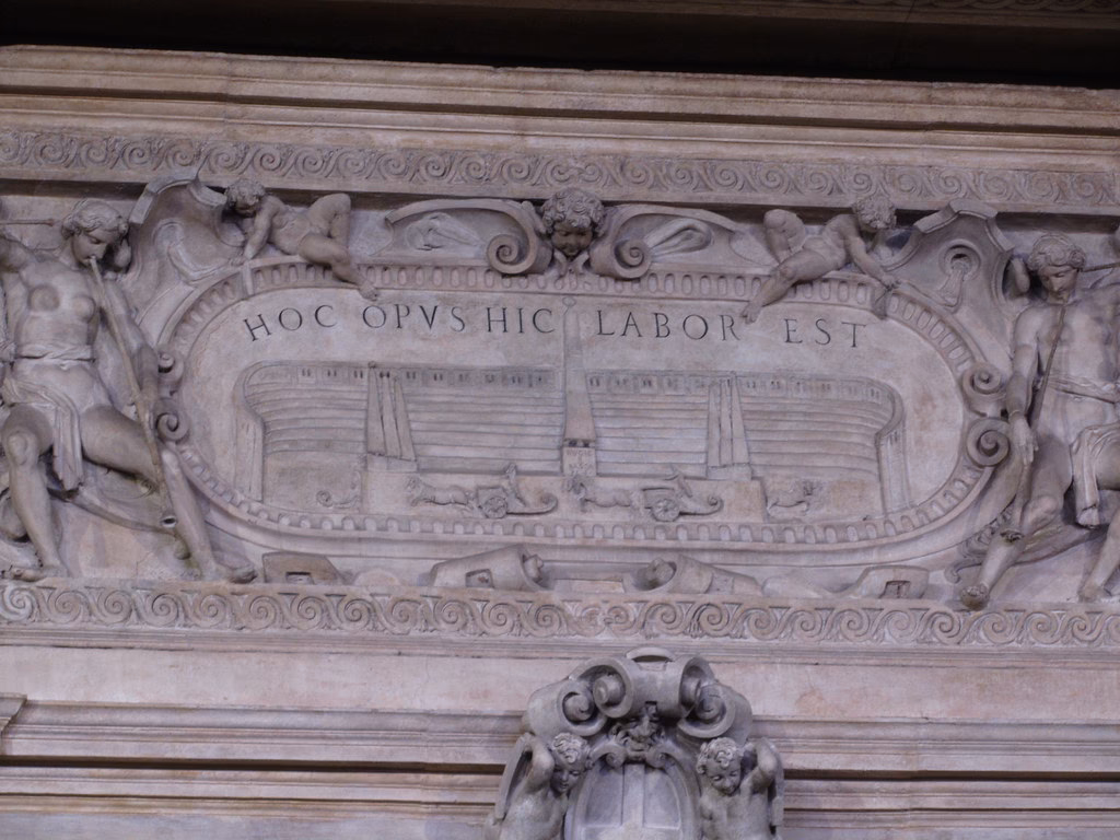 What does Labor omnia vincit mean?