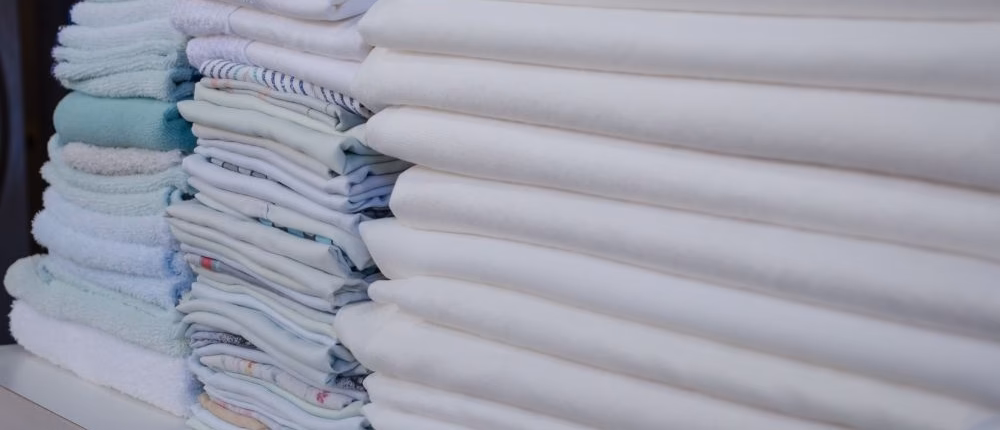 Why should a healthcare facility use a linen management service?