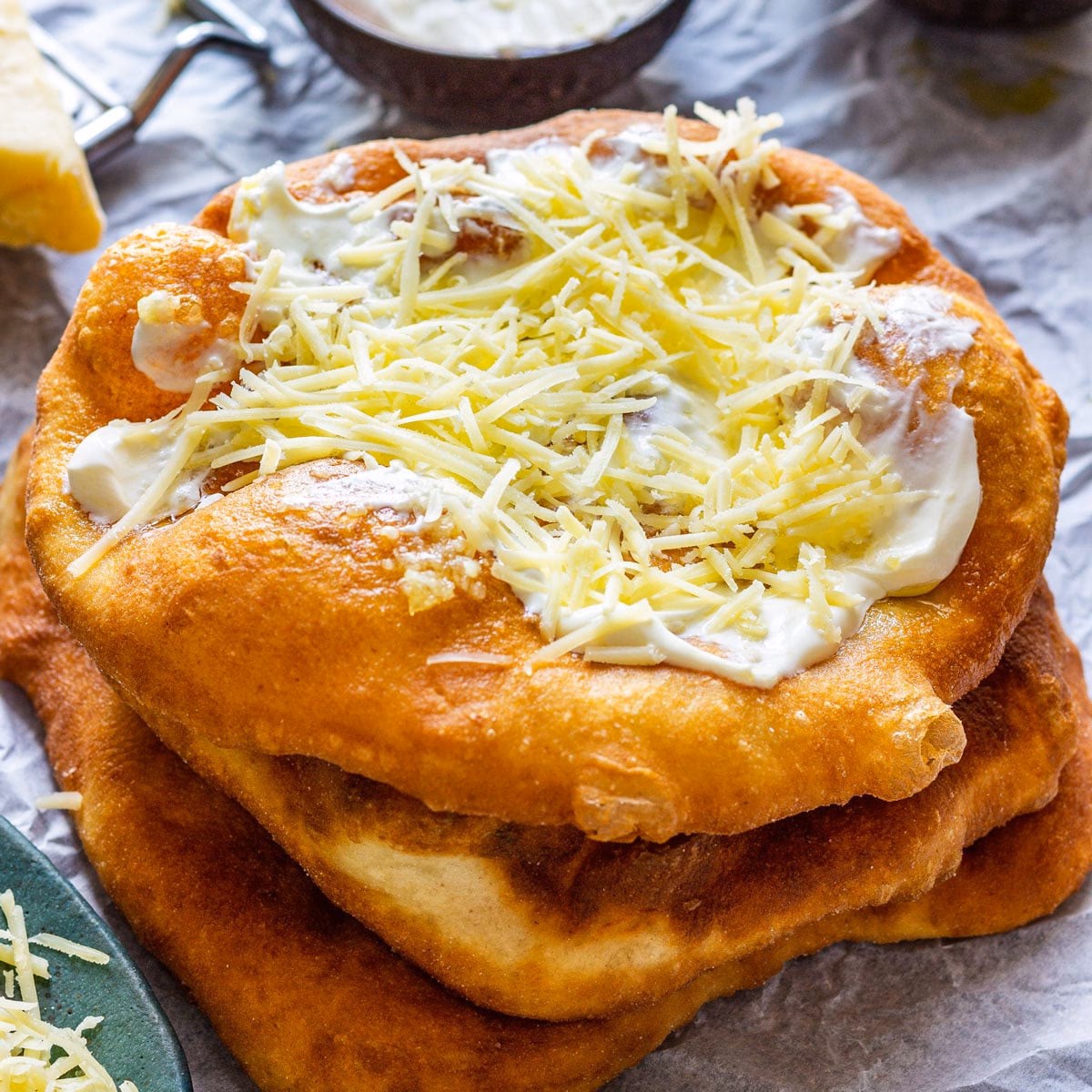 What is lángos topped with?