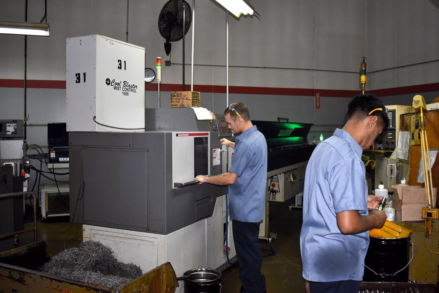 What is the role of a lathe machinist?