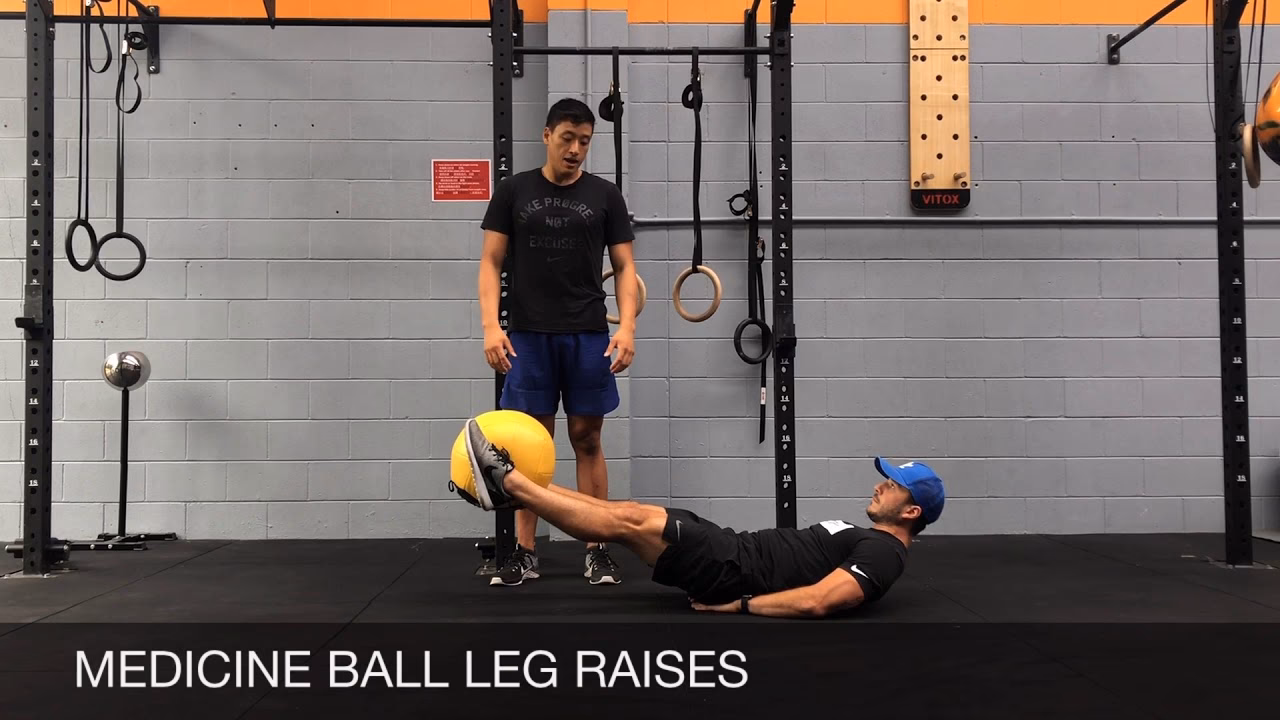 How do you lift a medicine ball?