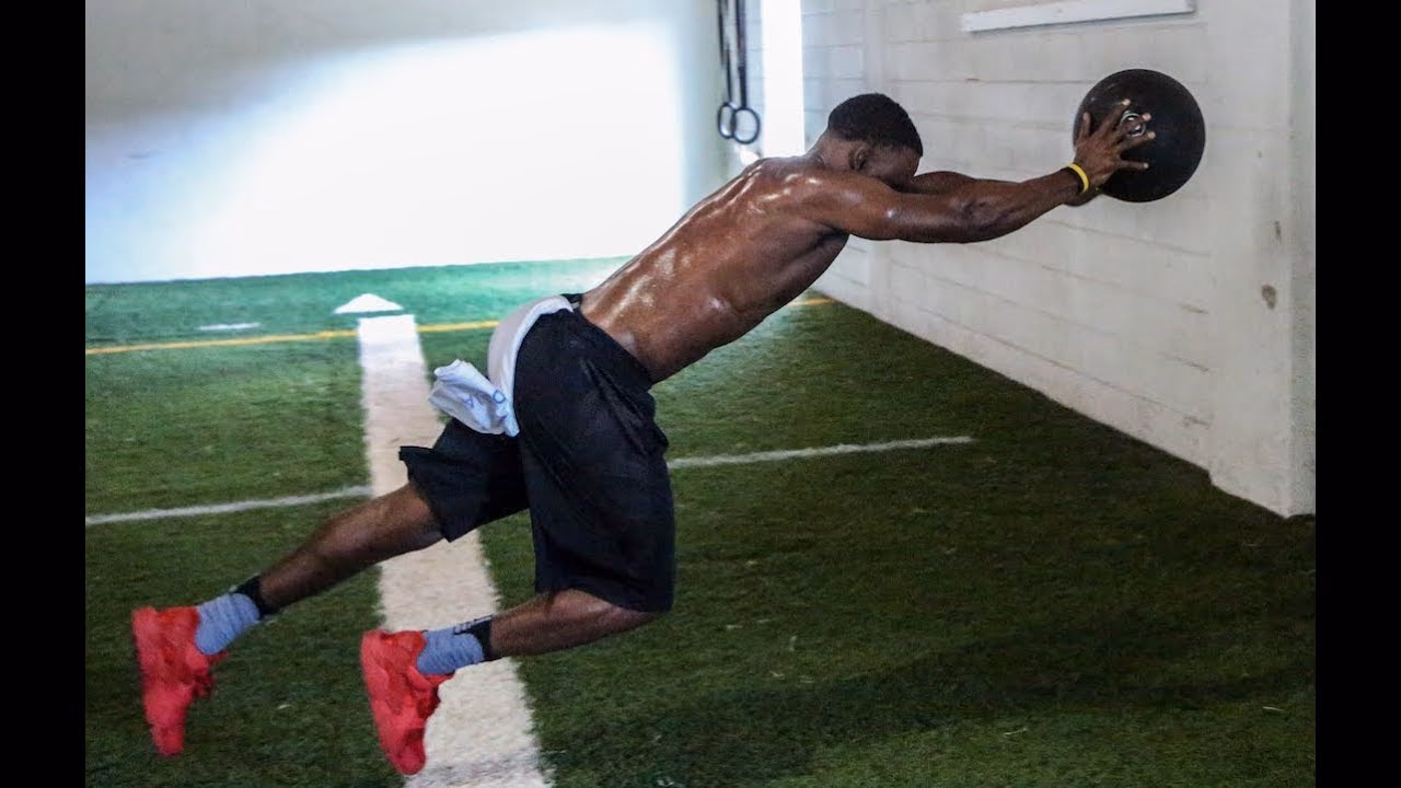 What is a medicine ball vertical scoop toss?