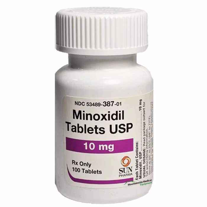 What are the side effects of minoxidil?