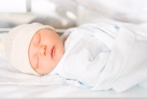 What kind of baby sleeps in a pediatrician's hand?