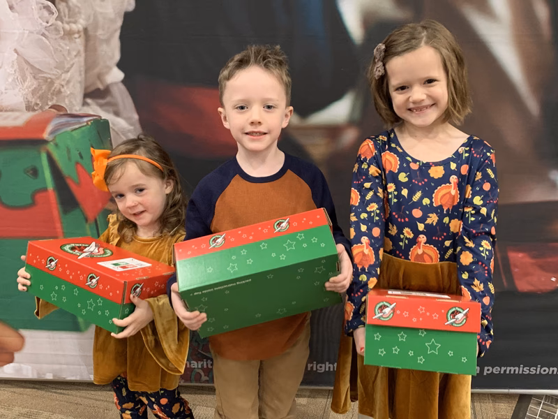 How does Operation Christmas Child tackle global poverty?