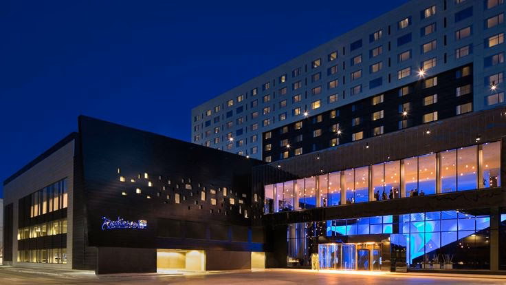 Who designed the first Radisson Blu Hotel?