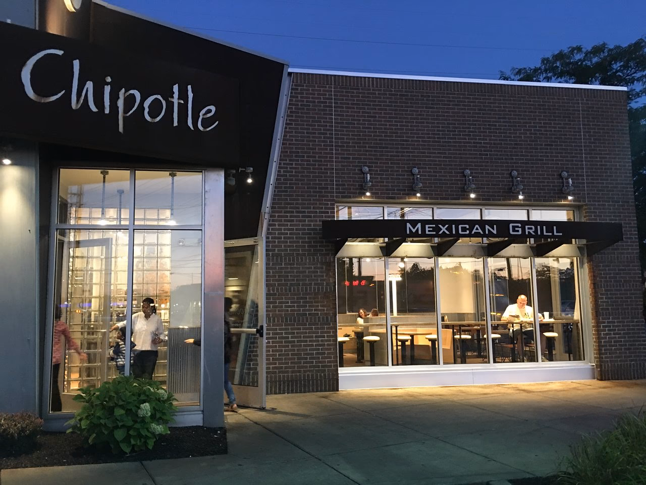 Who owns Chipotle Mexican Grill?