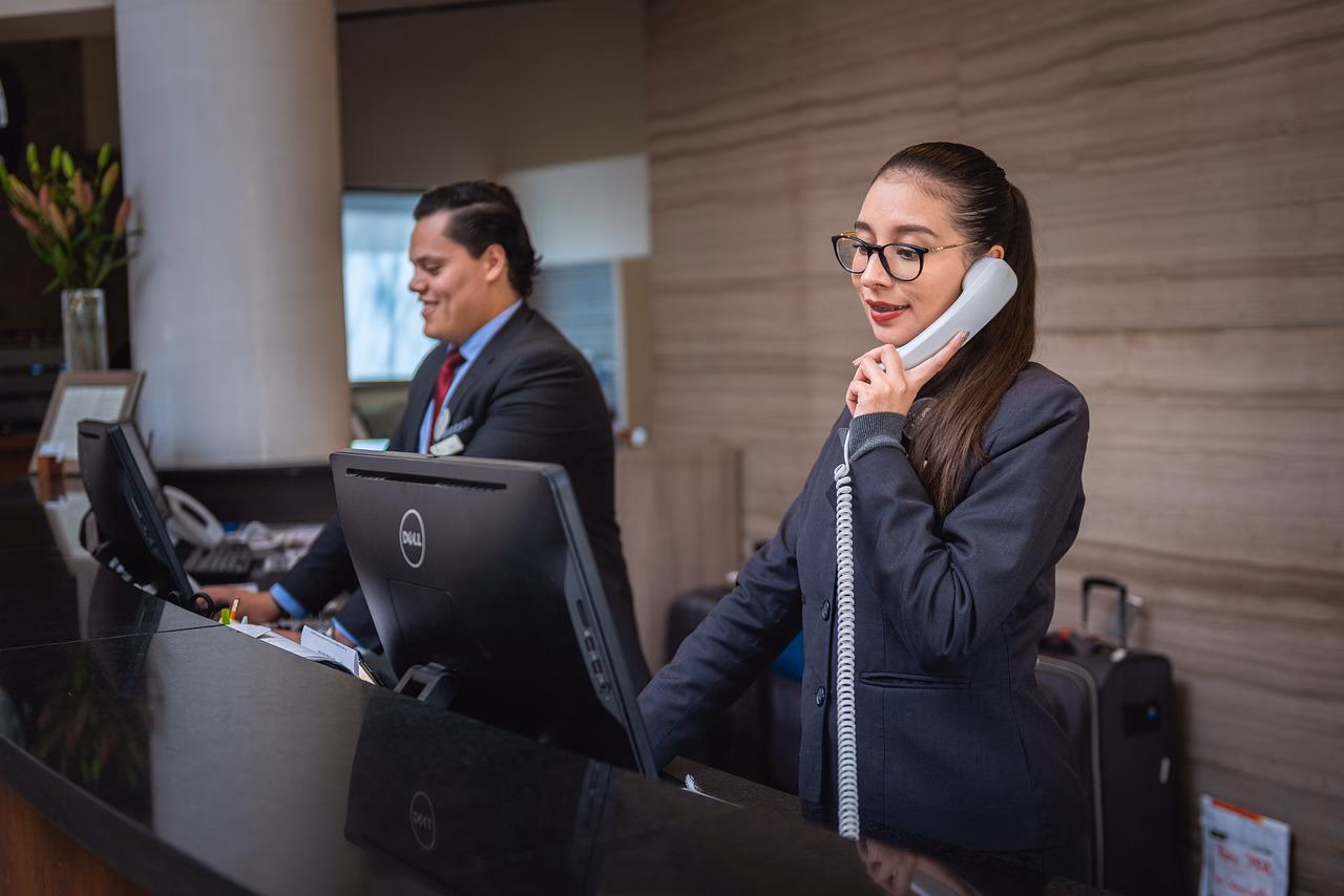 What are the duties of a receptionist?
