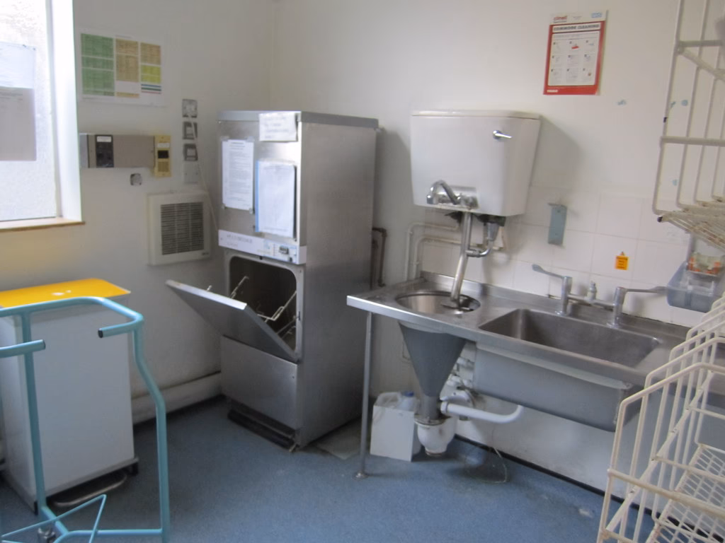 What happens when a clinician enters a sluice room?