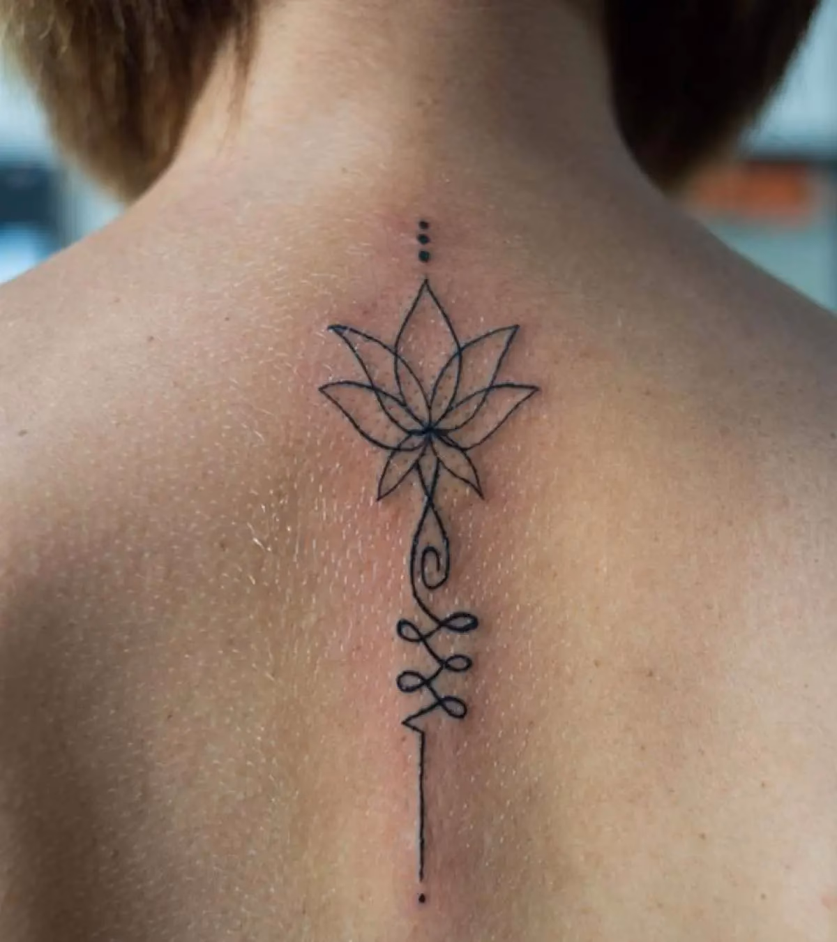 How do tattoo infections differ from tattoo allergic reactions?