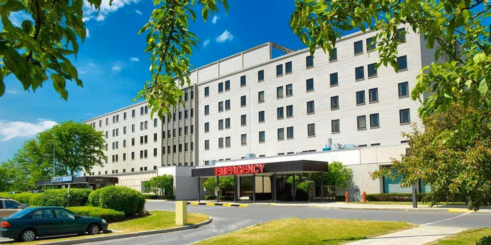 When did community General Hospital merge with Upstate Medical University?